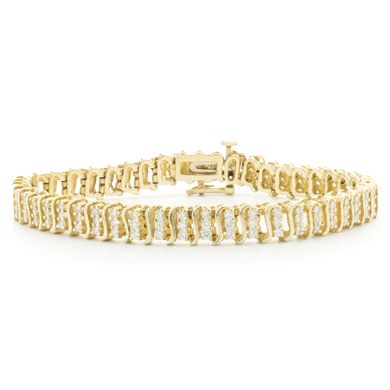 Ladies rhinestone bracelets-14 Karat Yellow Gold Triple Row Diamond S Link Tennis Bracelet