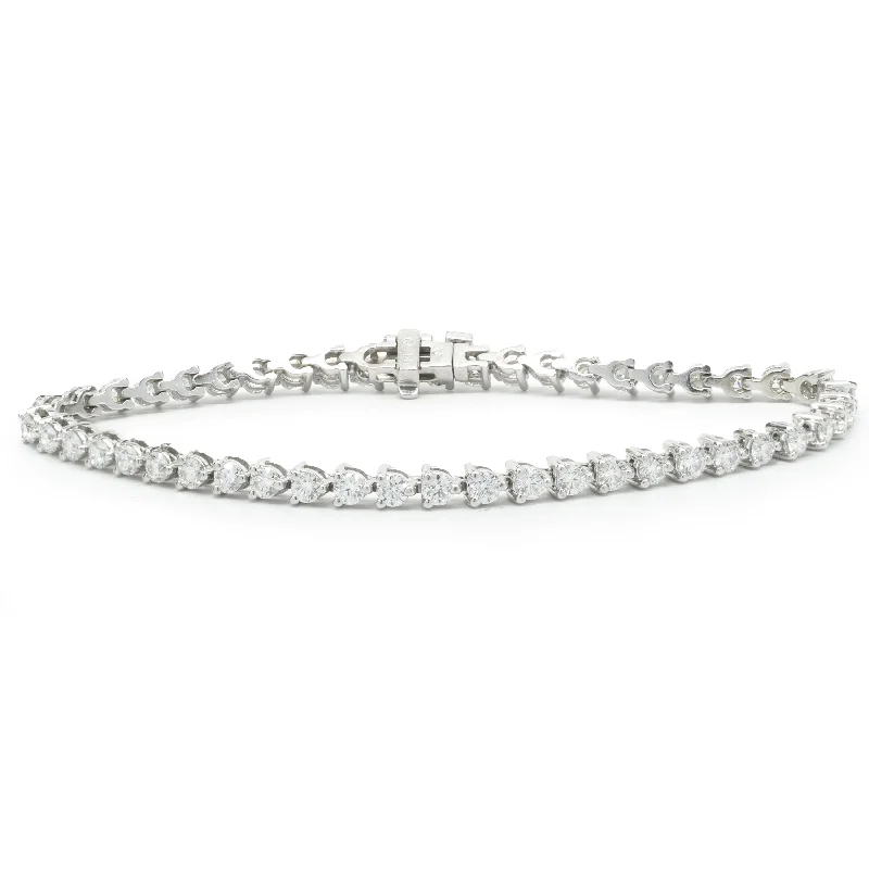 Ladies gemstone bracelets-14 Karat White Gold Three Prong Diamond Tennis Bracelet