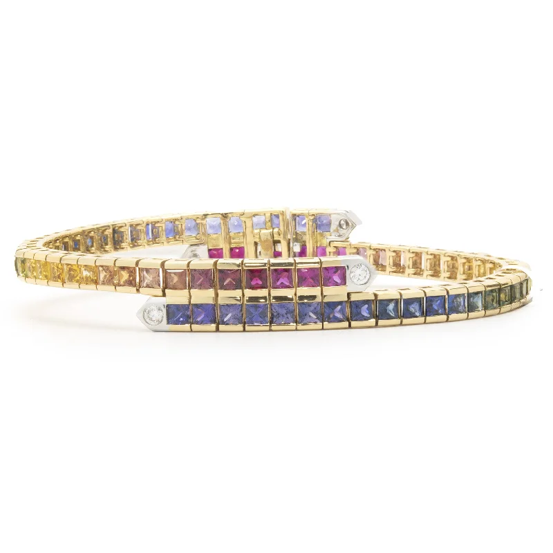 Ladies modern bracelets-18 Karat Yellow Gold Rainbow Sapphire and Diamond Bypass Bracelet